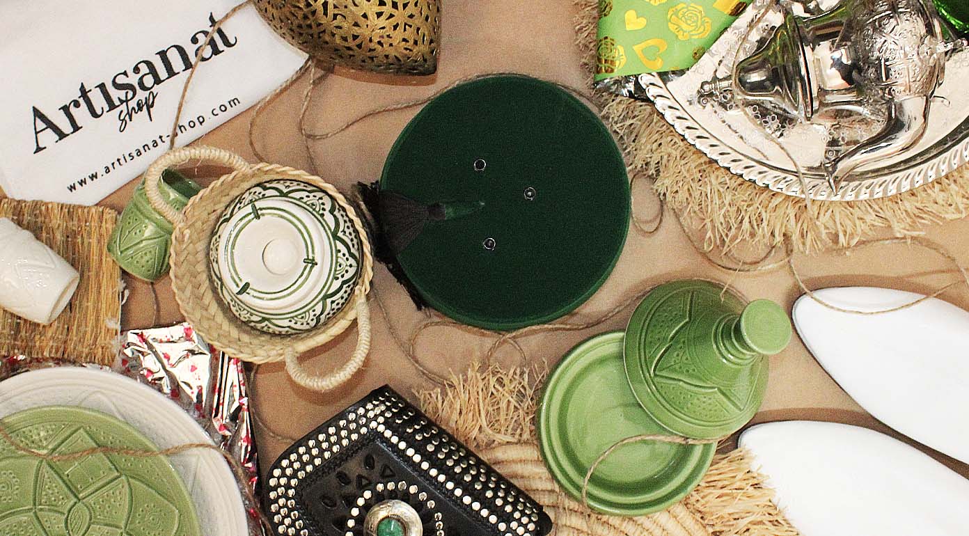 Overhead Moroccan gift composition with green tableware and silver accessories