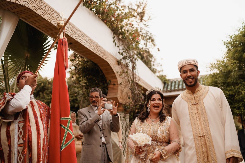 Moroccan newlyweds celebrating outdoors with family and friends